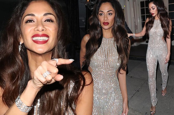 Nicole Scherzinger covers her bum as she shows off her jaw-dropping figure in a sparkling gold jumpsuit