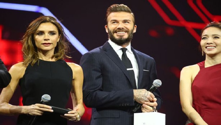 Victoria Beckham shows off her Super Slim frame for a rare stage appearance with husband David