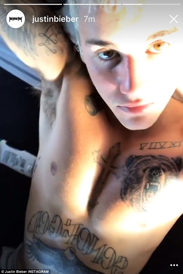 Shirtless Justin Bieber sends fans into meltdown as he displays his new chest tattoos in latest Selfie