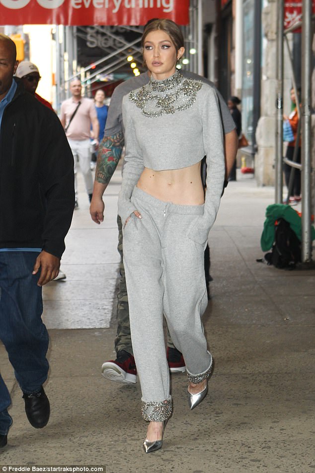 Gigi Hadid shows off her enviable model figure in bedazzled grey crop top and matching trousers in New York City