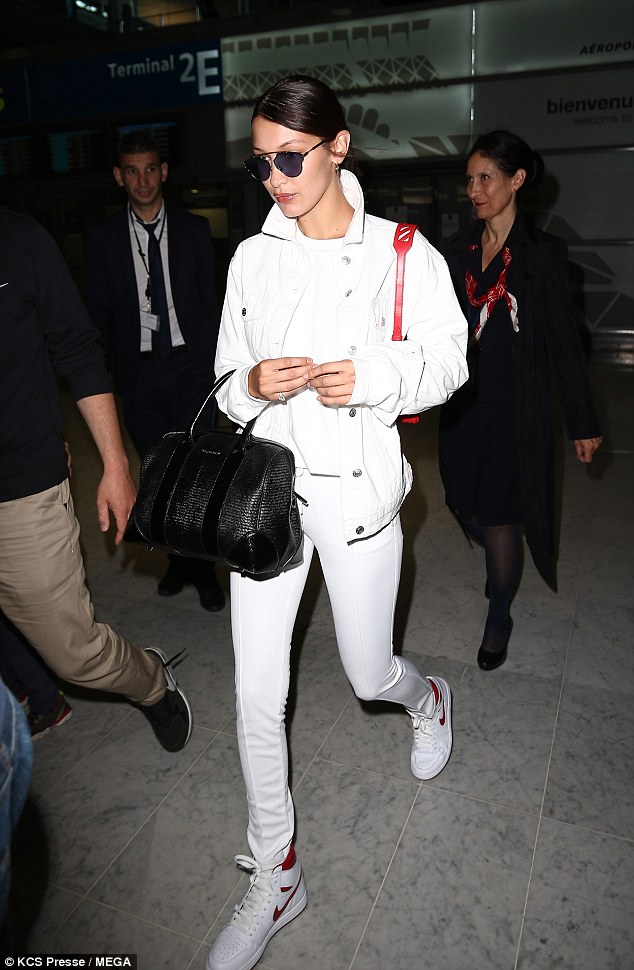 Bella Hadid shows off her slender figure in head-to-toe white as she rocks sports-chic ensemble for flight to Paris
